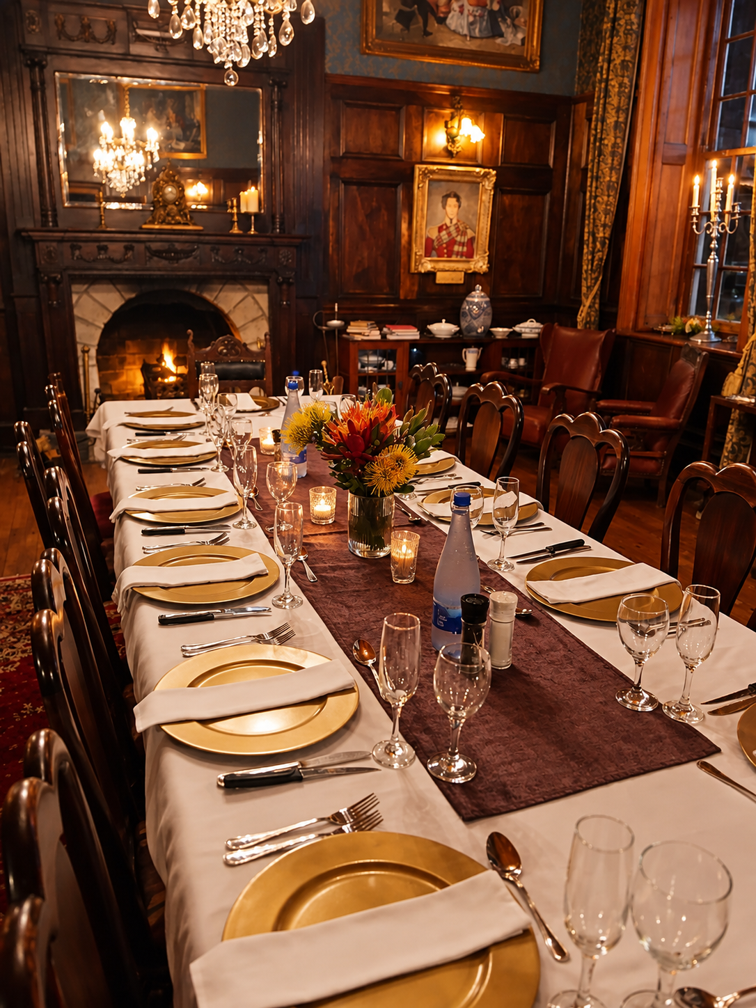 Candlelit table set for the Courts of the Forest grand finale banquet at Portland Manor