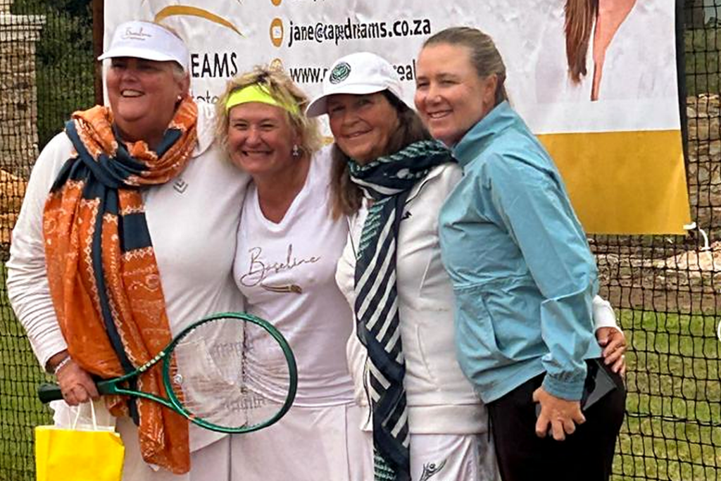 Ceri wearing a Roland-Garros scarf, Marzahn in a Baseline T-shirt, Debbie Hyde wearing a Wimbledon scarf and Lucinda in a jacket at Courts of the Forest.